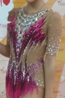 Slimming magenta rhythmic gymnastics leotard